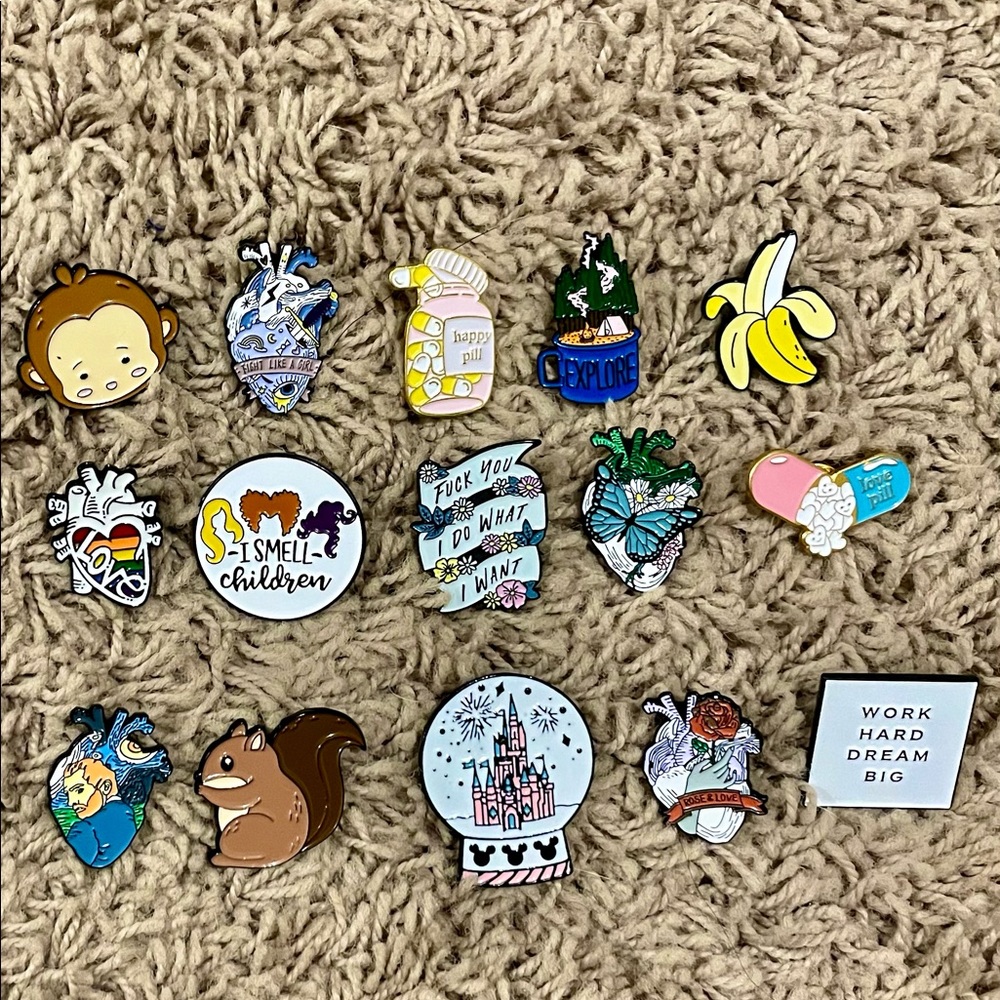 15 assorted enamel pins